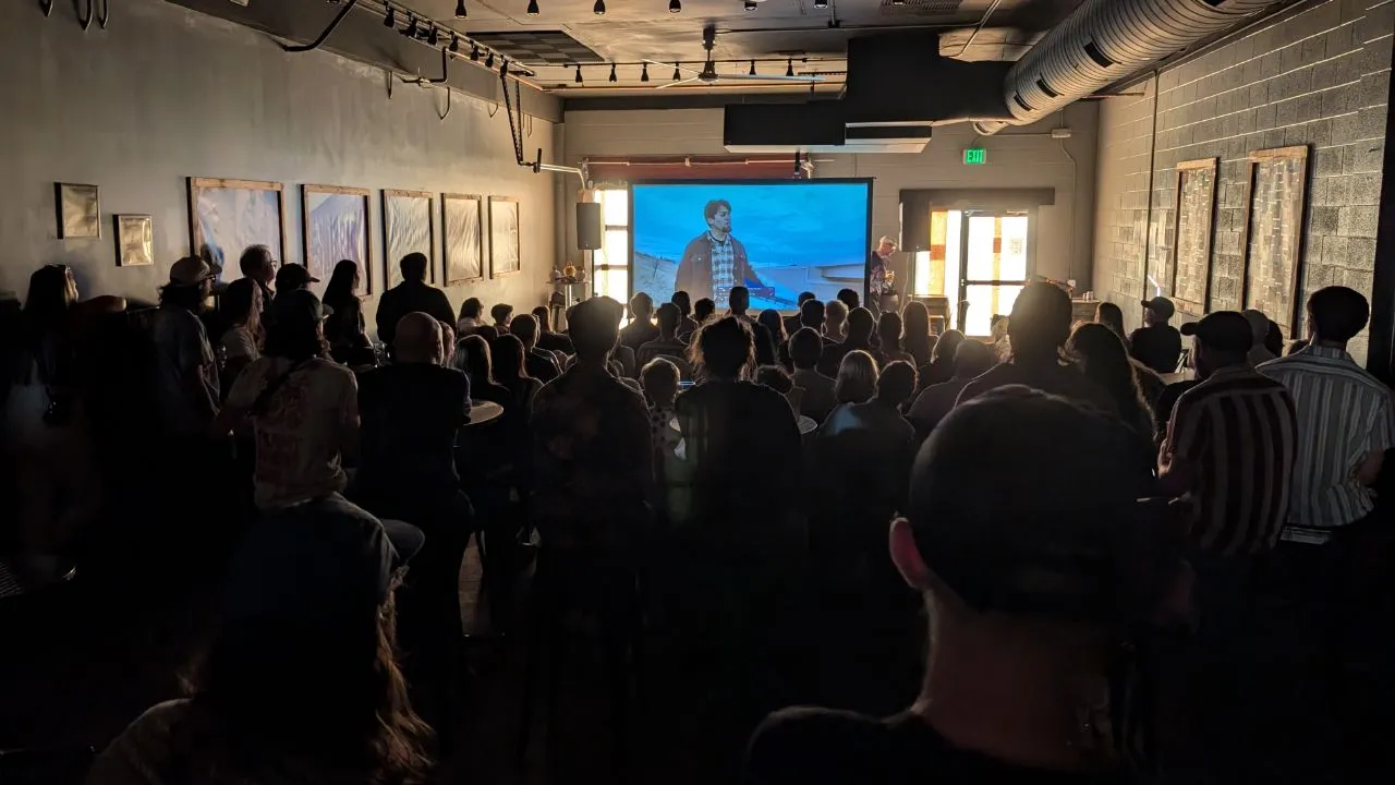 audience members watching the Side Hustle Film Fest 2025 films in River North Brewery