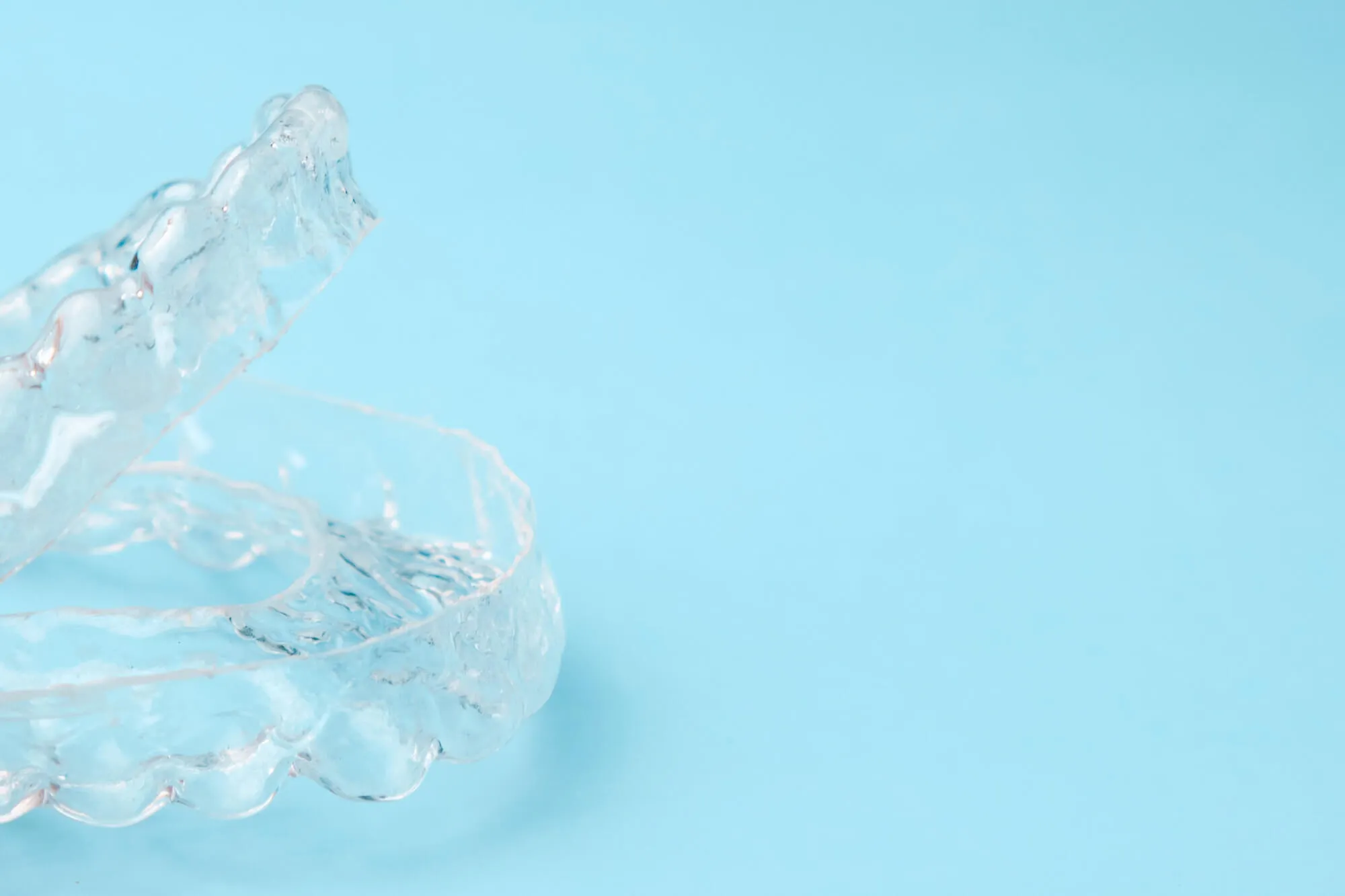 clear aligners for teens birmingham al on light blue background
