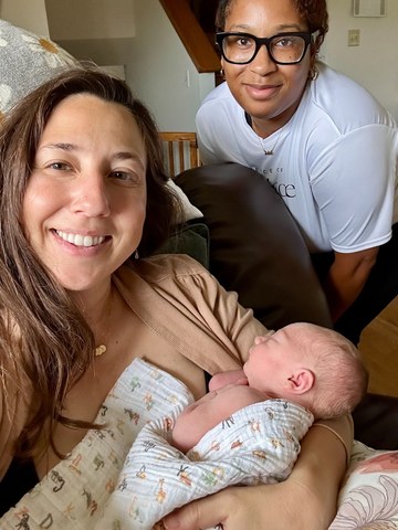 Amanda with her newborn and her doula
