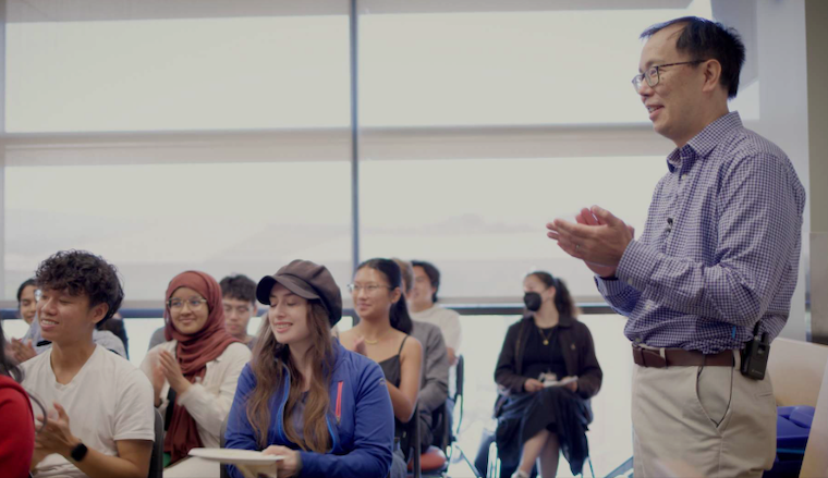 Dr. Bryant Lin at a lecture with students
