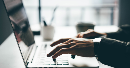 person typing on computer