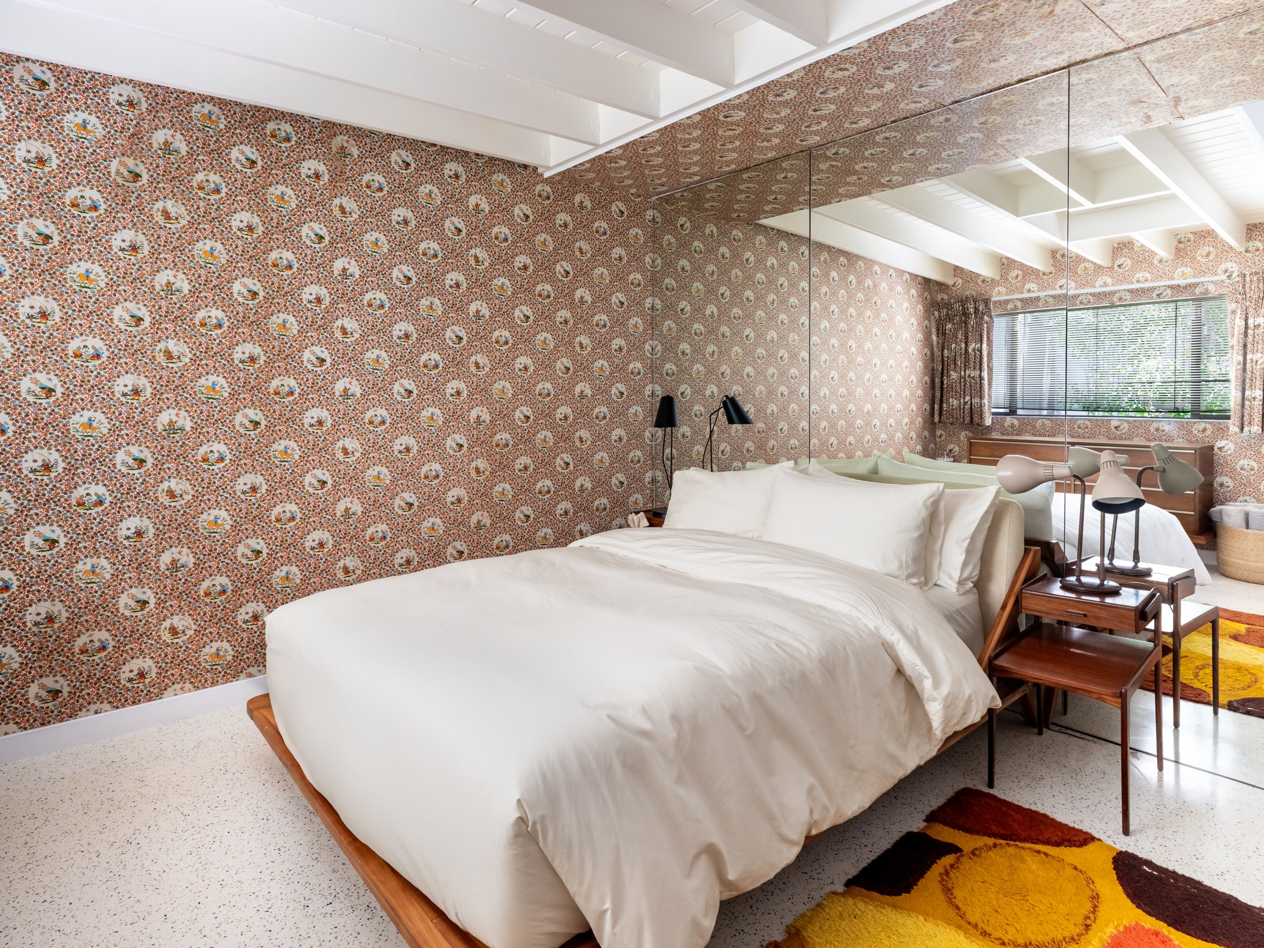Bedroom with patterned wallpaper