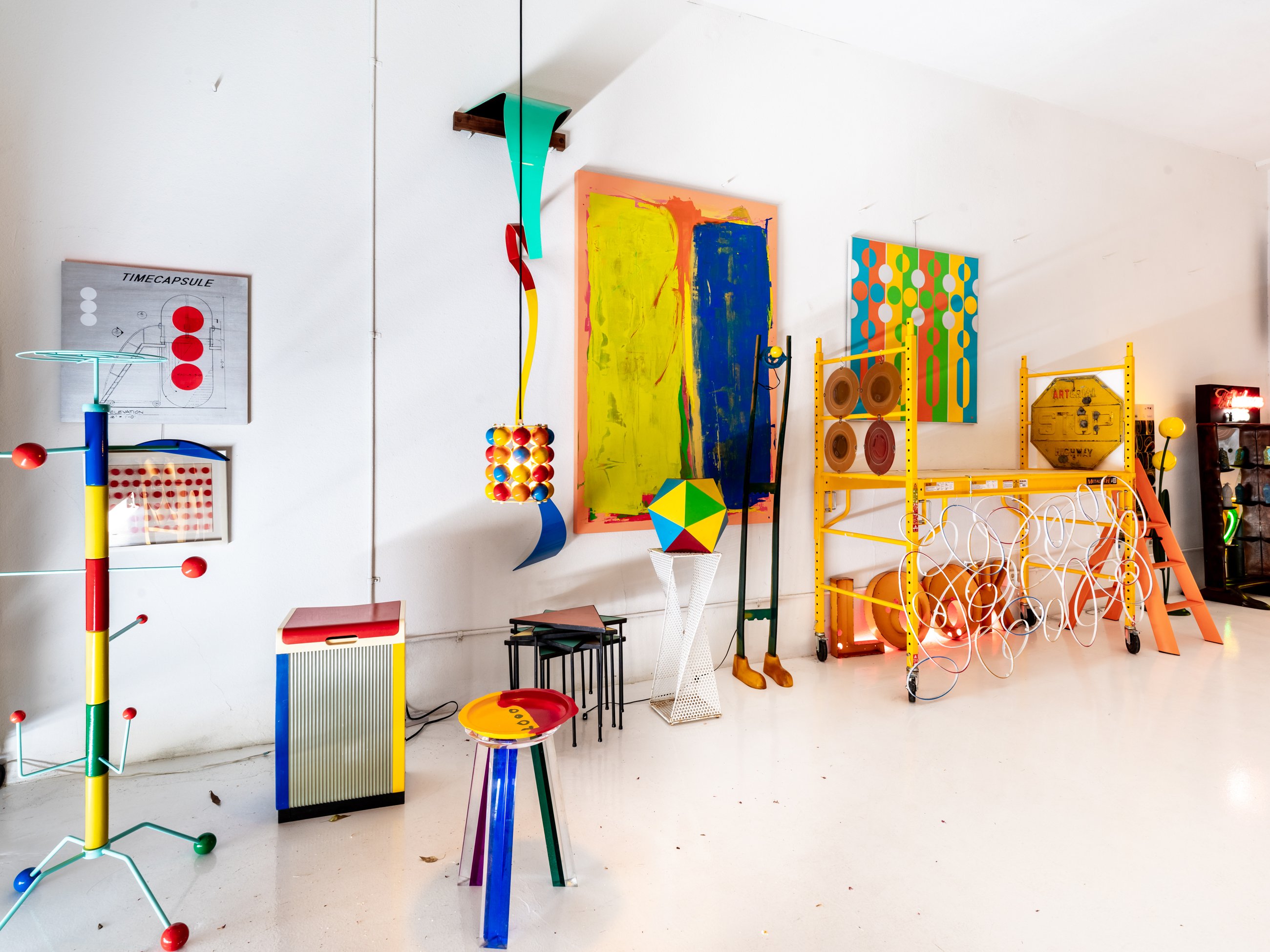 Colorful corner of sculpture, furniture and abstract paintings