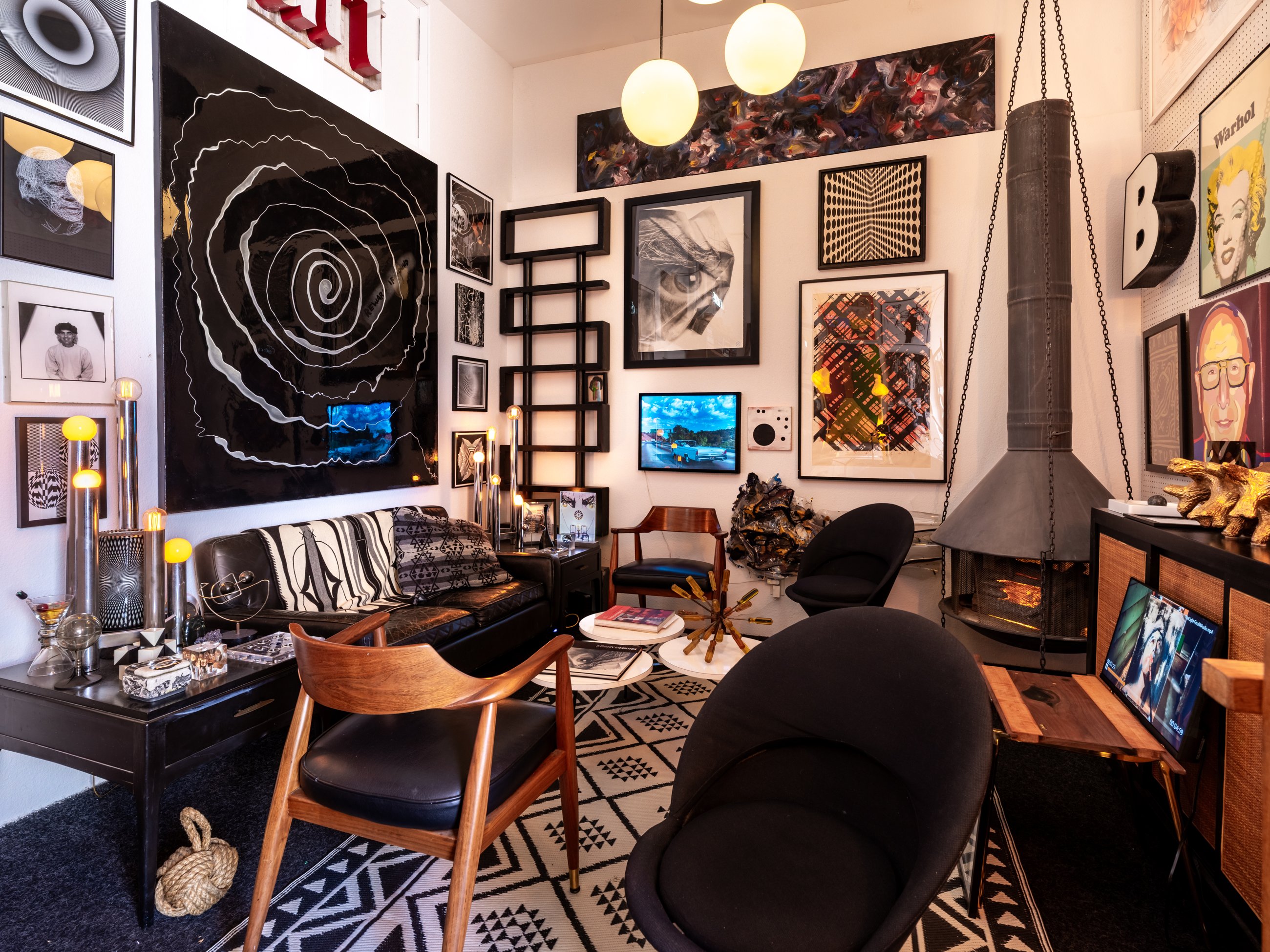 Wide view of the fireplace lounge and art collection
