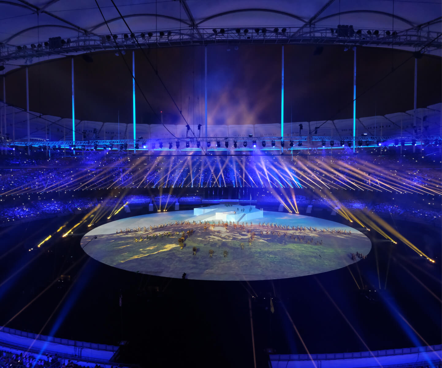 A sports arena illuminated by blue colored light