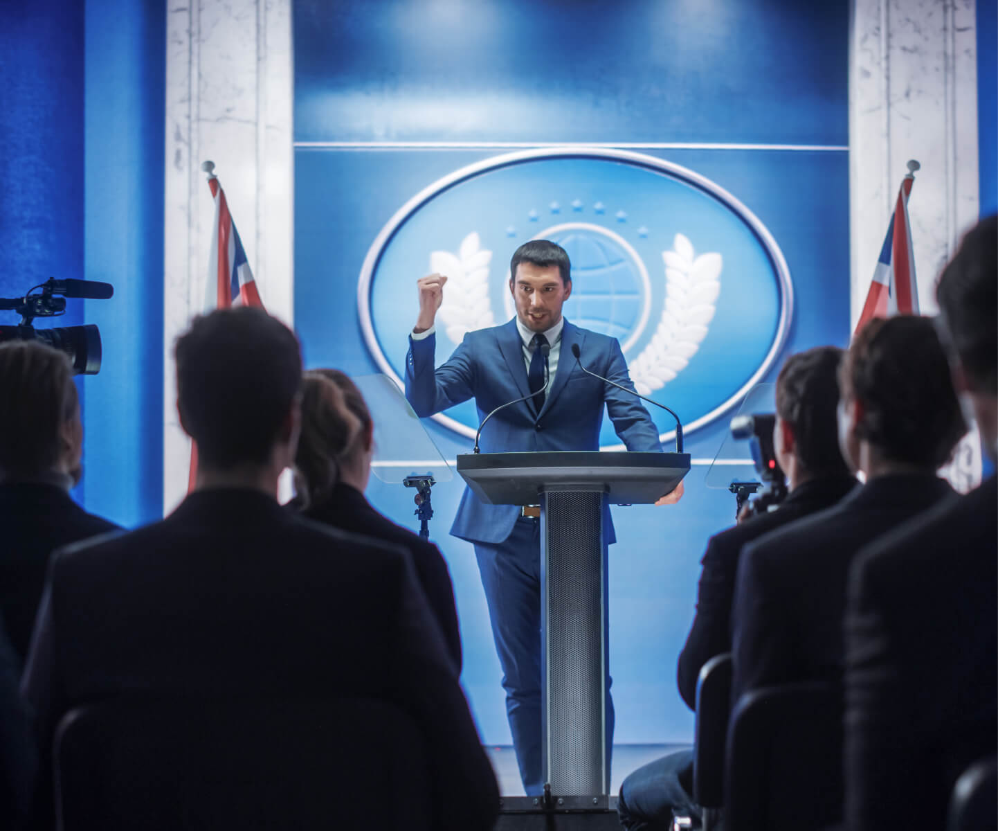 A leader delivering a speech in front of a crowd