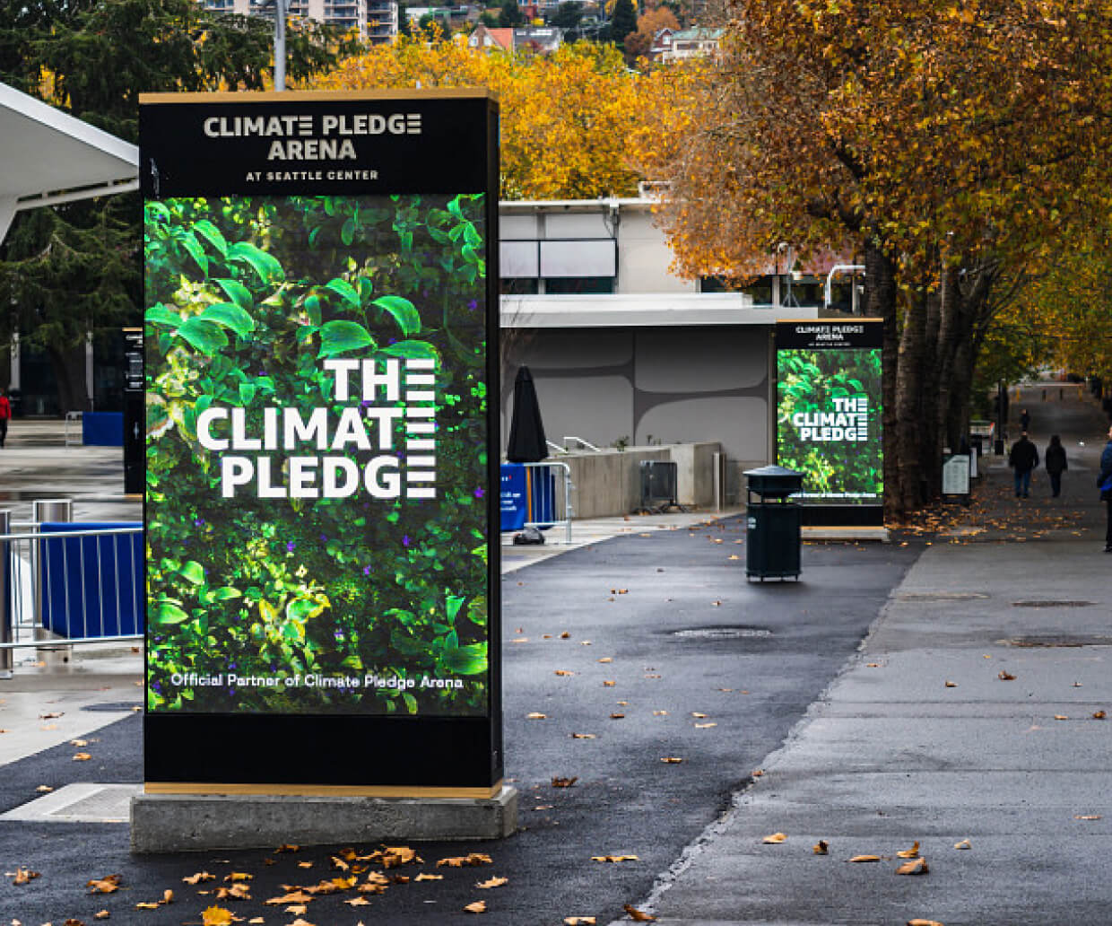An LED poster with the words "The Climate Pledge"