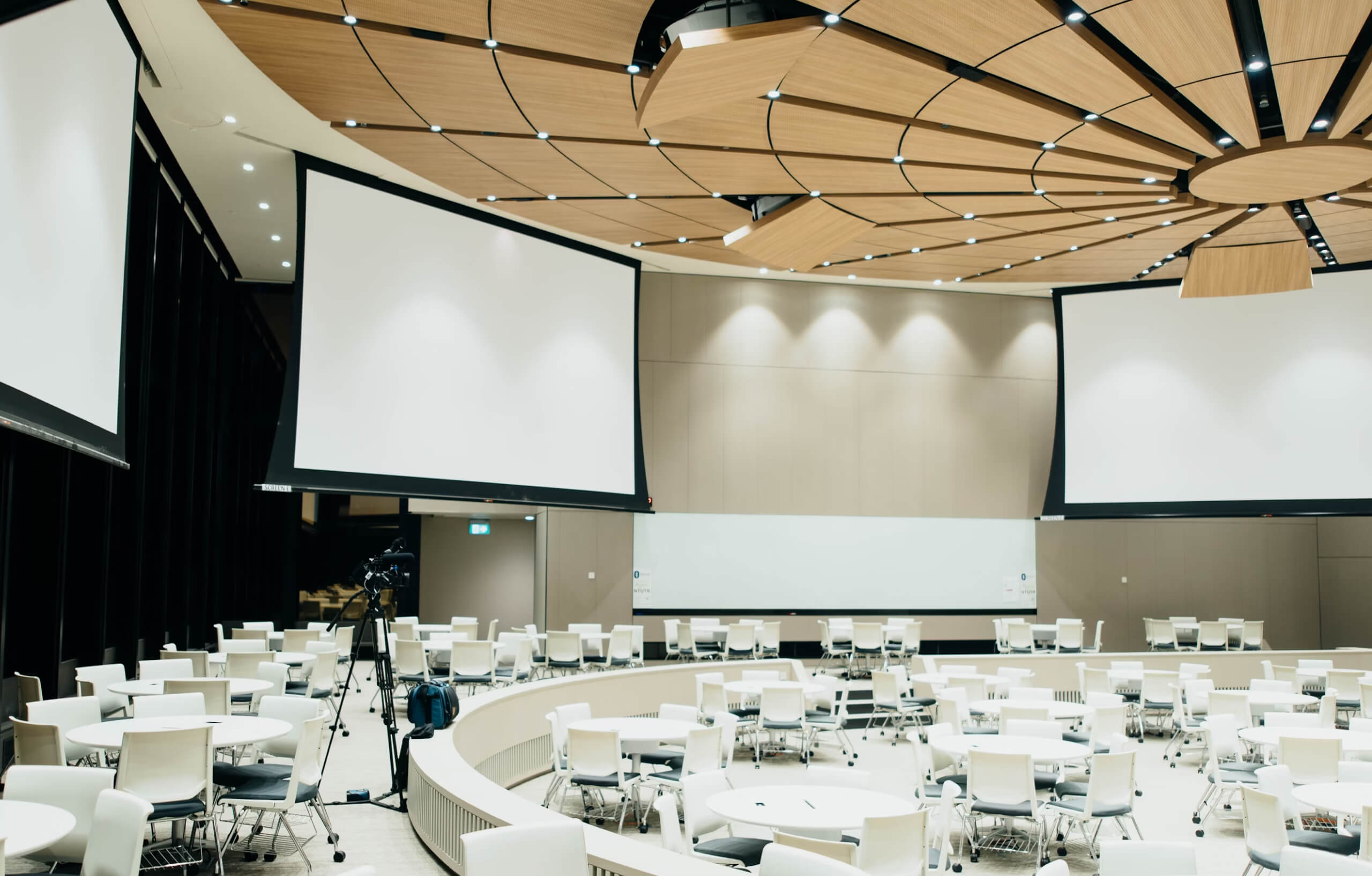 3 projection screens in a conference room