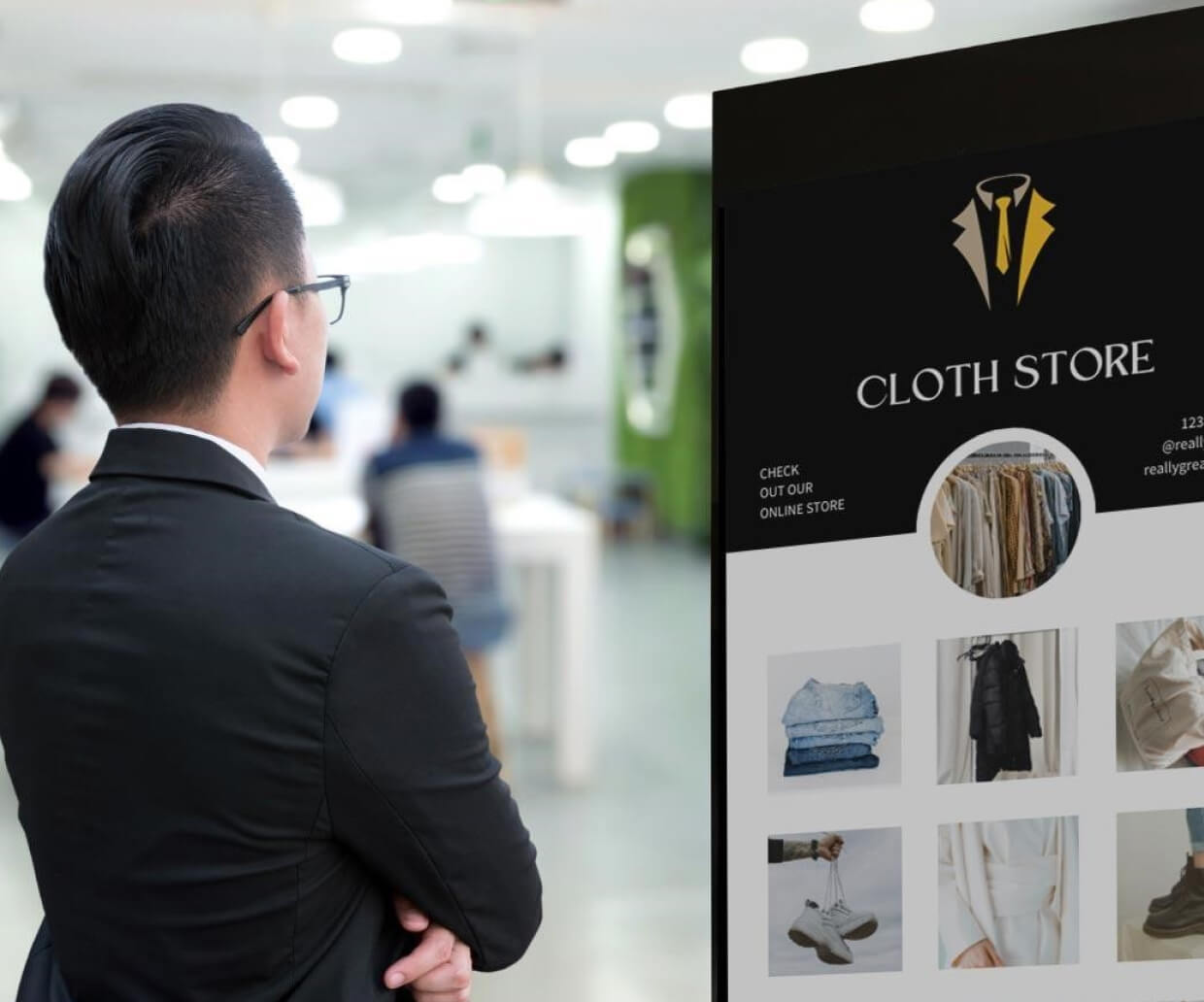 A man looking at clothes in a vertical touch kiosk