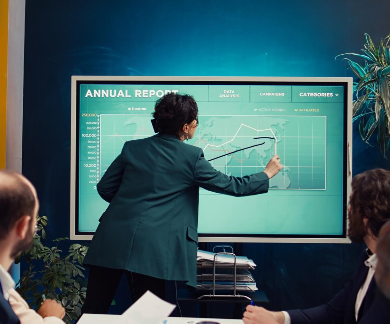 A man discussing the annual report with his staff