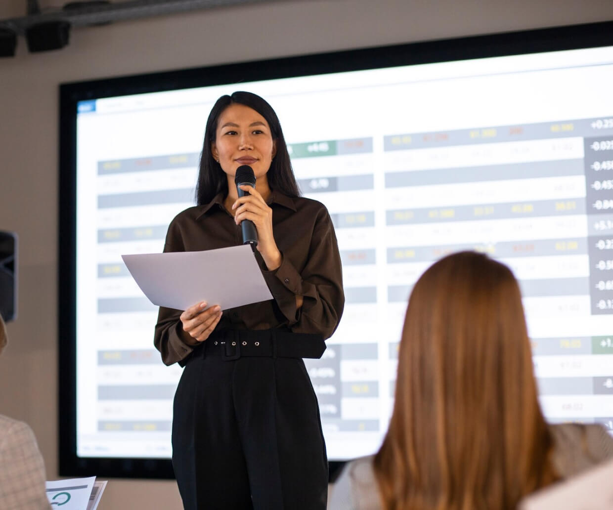 A woman holding a microphone