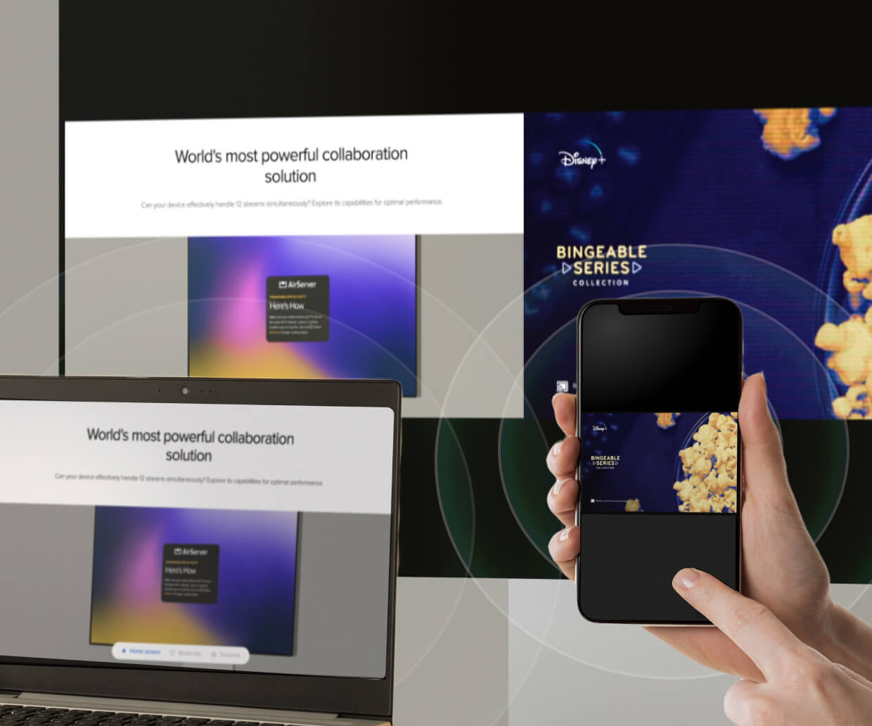 A projection screen, laptop, and iPhone