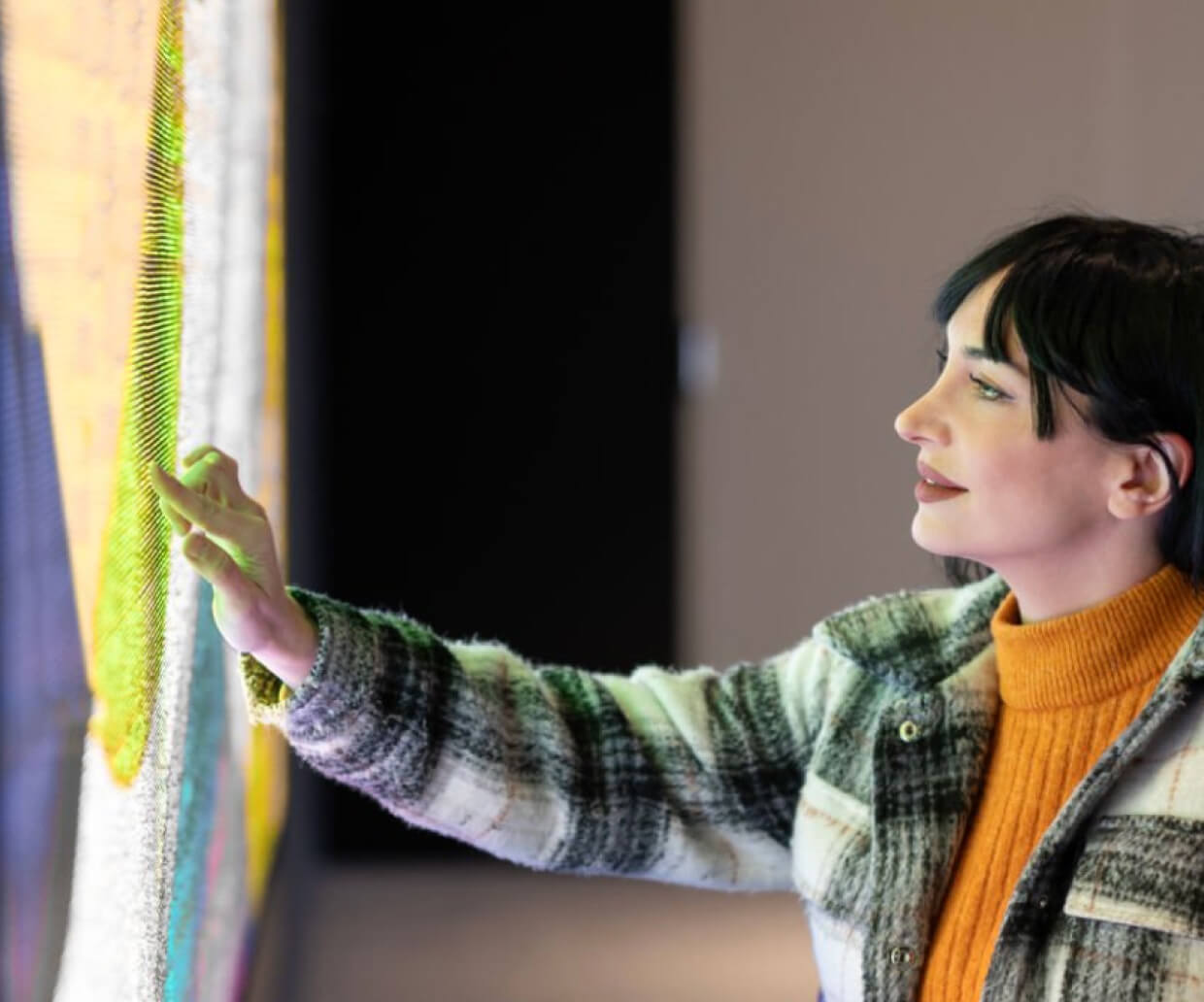 Woman interacting with LED wall