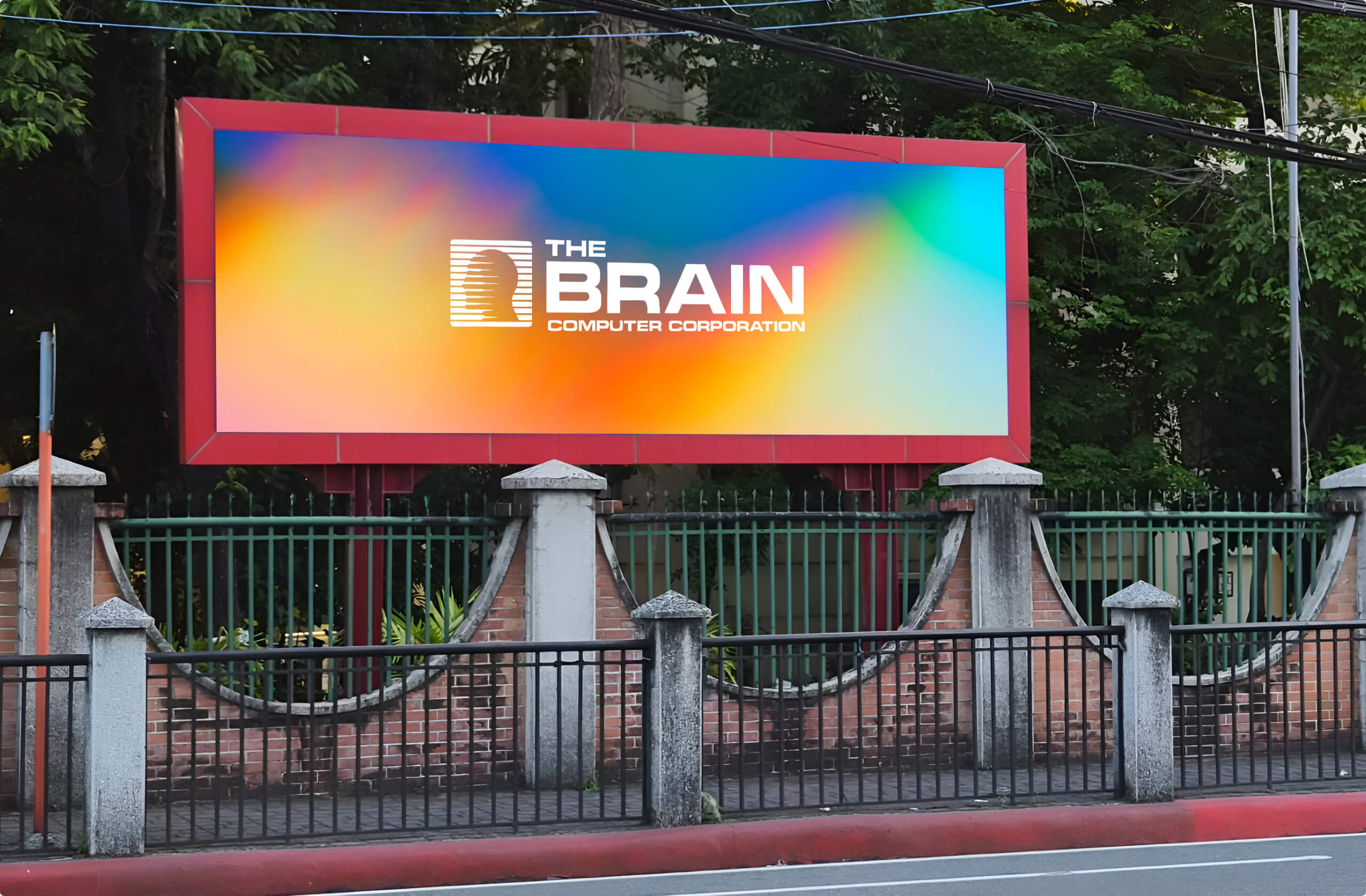 Large outdoor LED billboard displaying The Brain Computer Corporation logo with colorful gradient background.