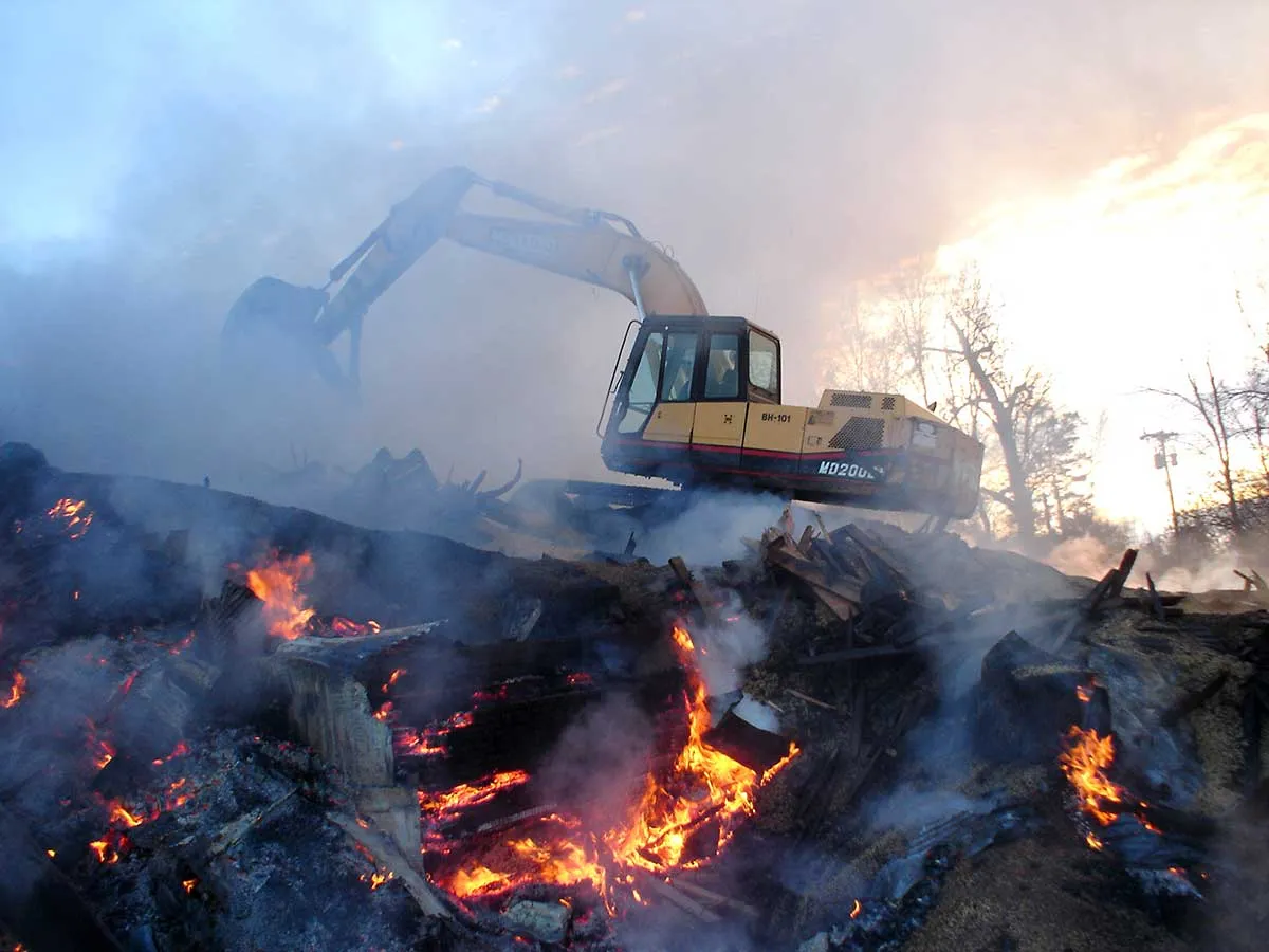 excavator working on fire damage