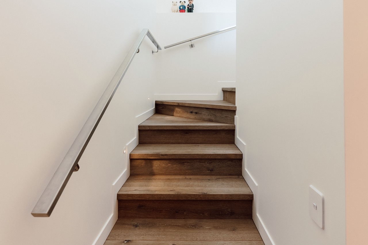 Timber staircase with steel handrail at 124 Diana Ave, Whangamatā