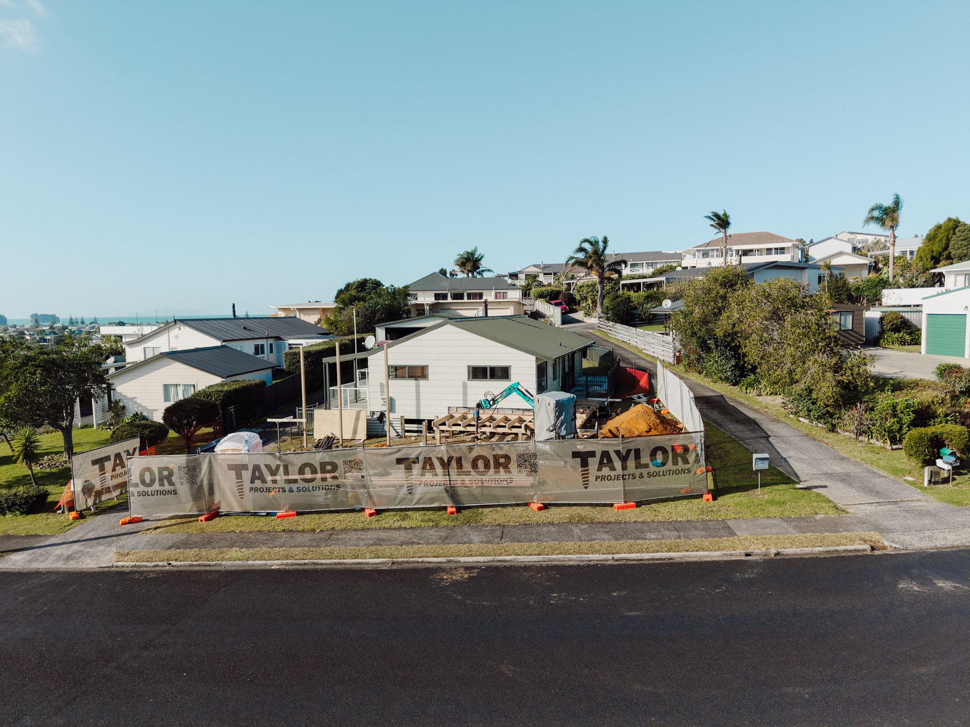 Aerial view of the 212 The Drive site, Whangamatā, with Taylor Projects banners
