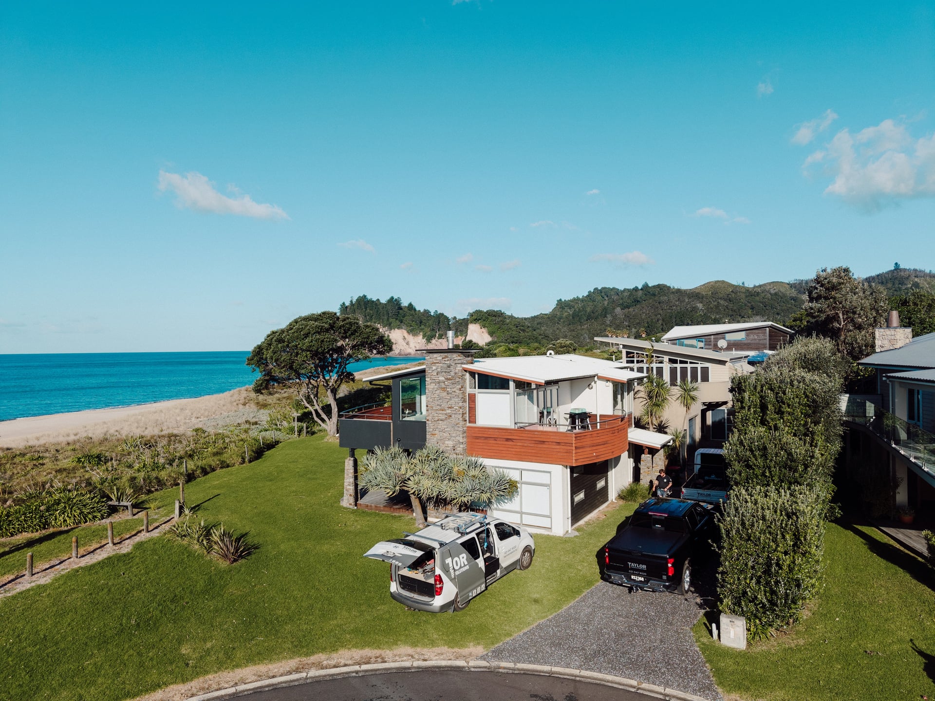 Aerial view of the home at 12 Tuna Place, Whiritoa, above the beach