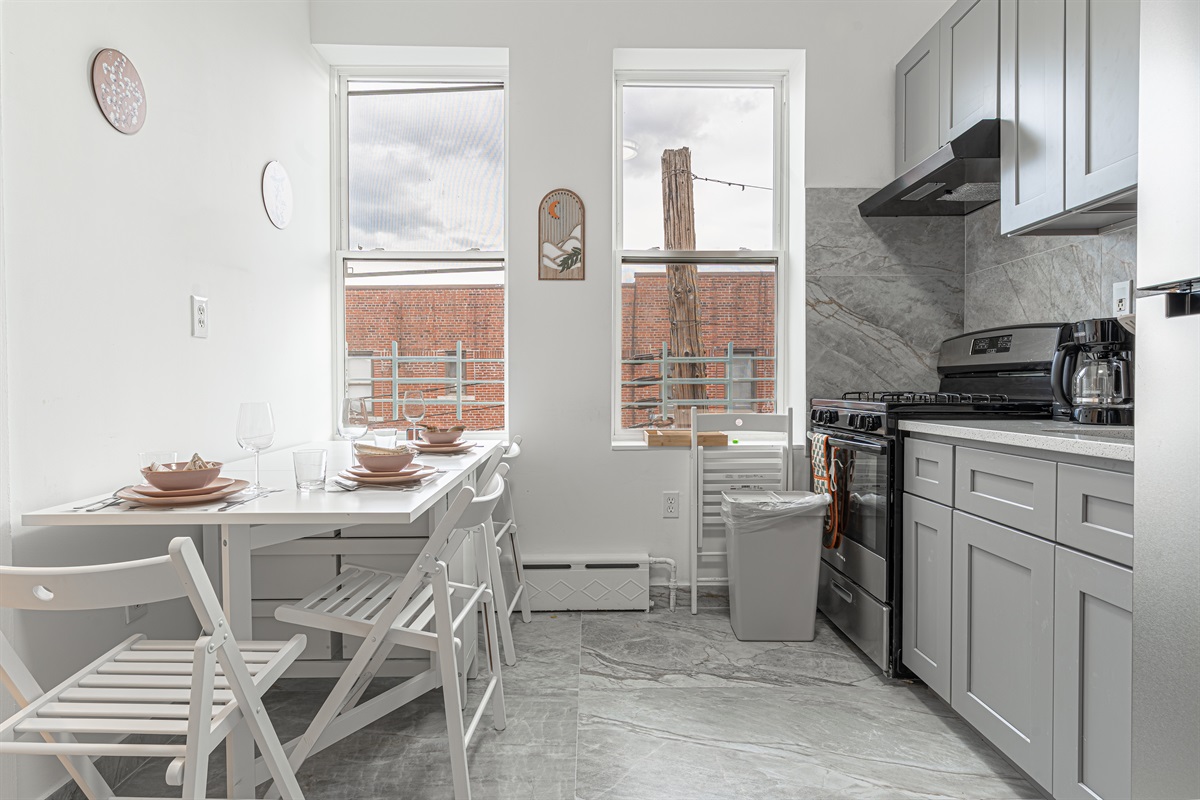 Open kitchen-and-dining layout keeps the group together while you cook, eat, and plan the day's adventures.