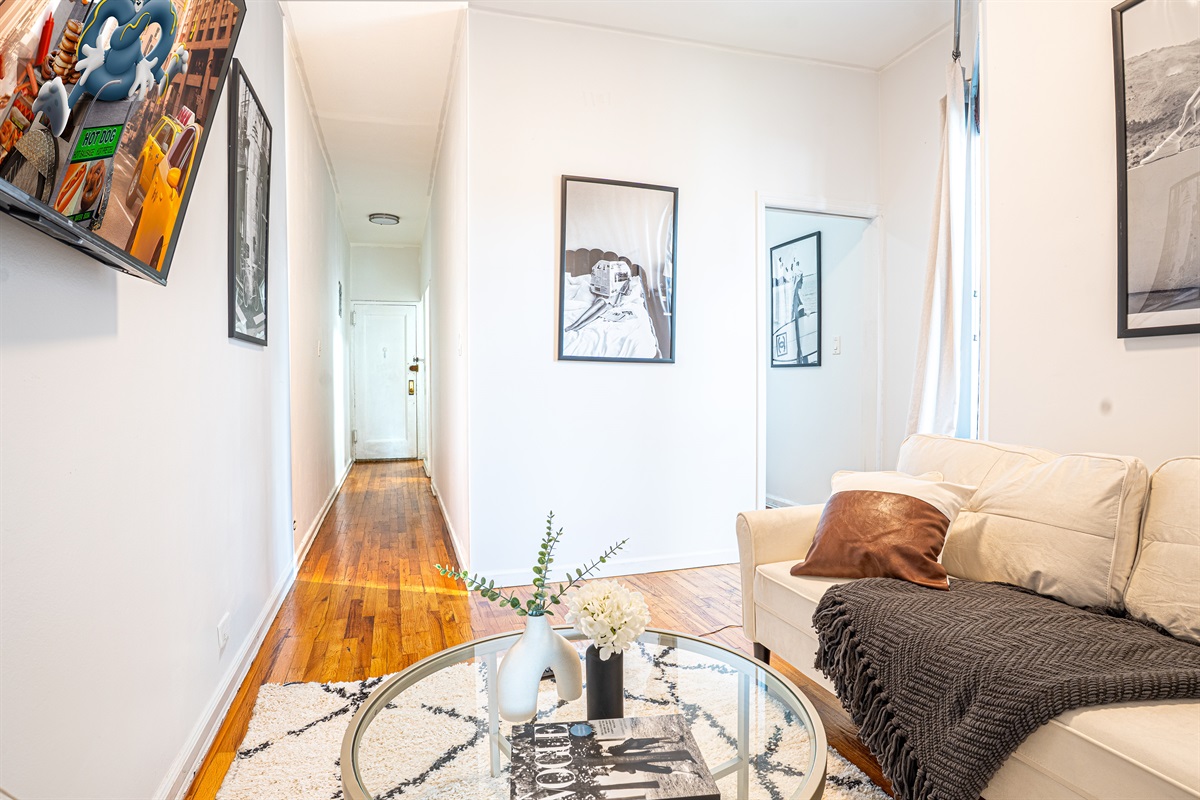 Modern lounge with sofa, TV, and chic decor accents
