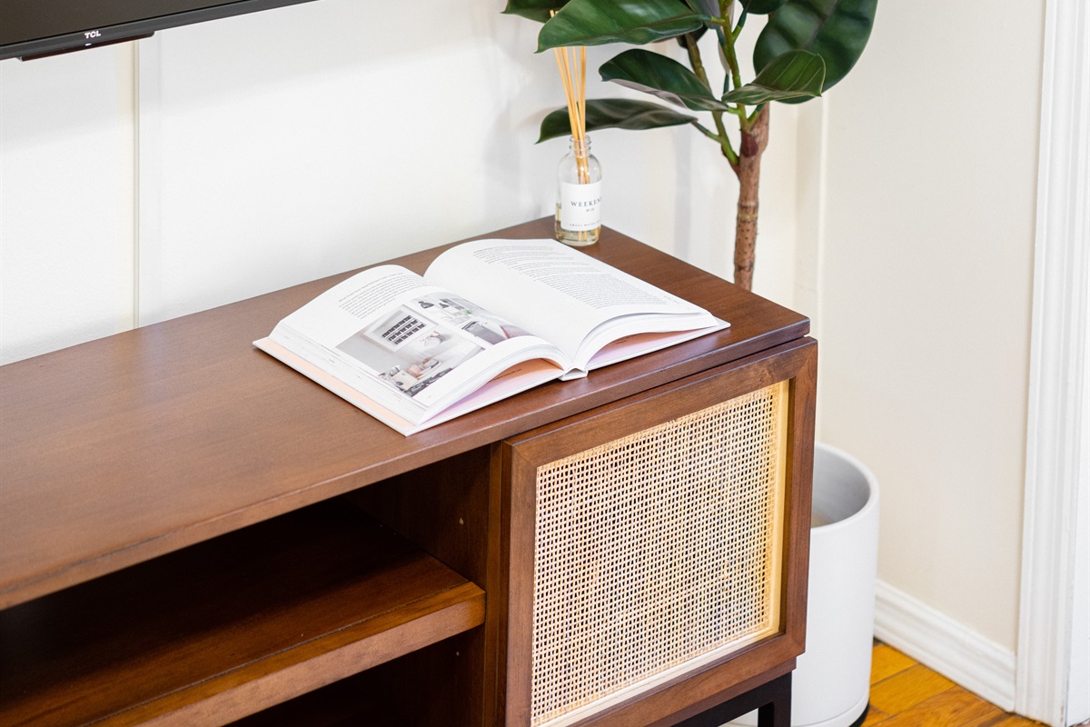 Modern TV corner with cozy minimalist design.