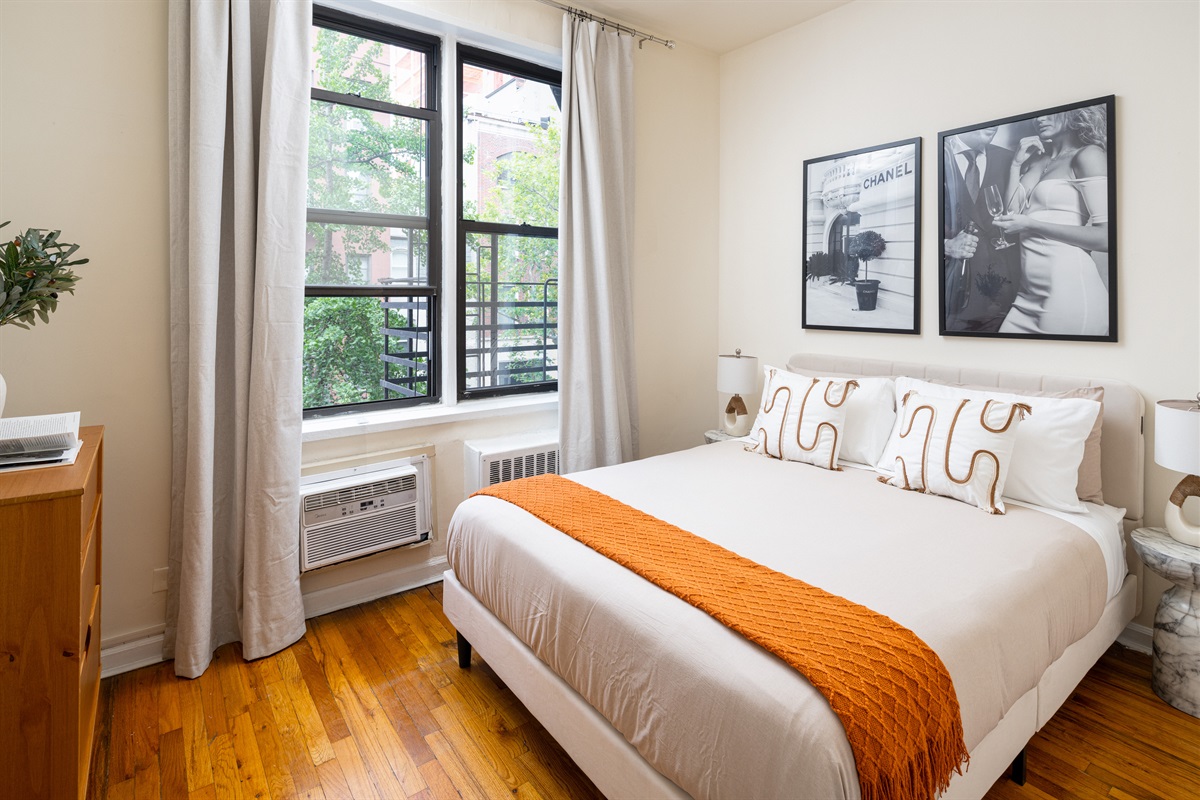 Cozy modern bedroom with warm accents.