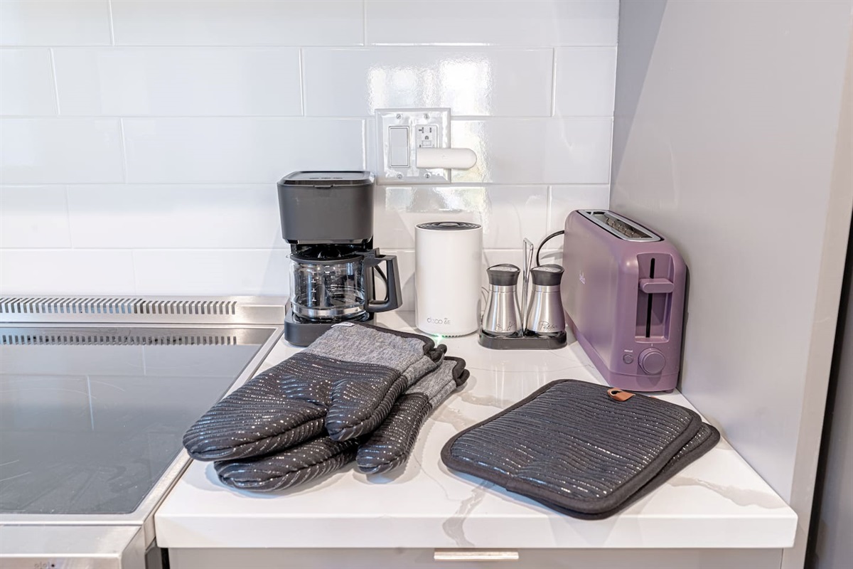Well-stocked kitchen with utensils, cookware and essentials to support your culinary creativity