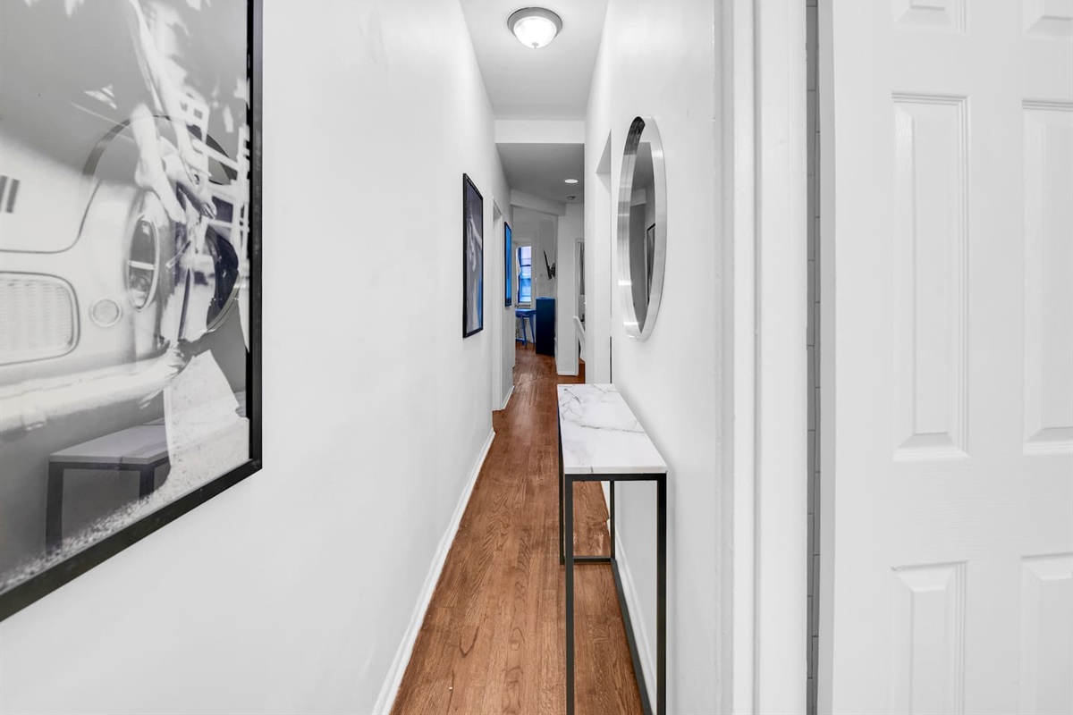 Clean, modern bathroom with classic subway tile and hex flooring — fresh towels and toiletries provided for your arrival