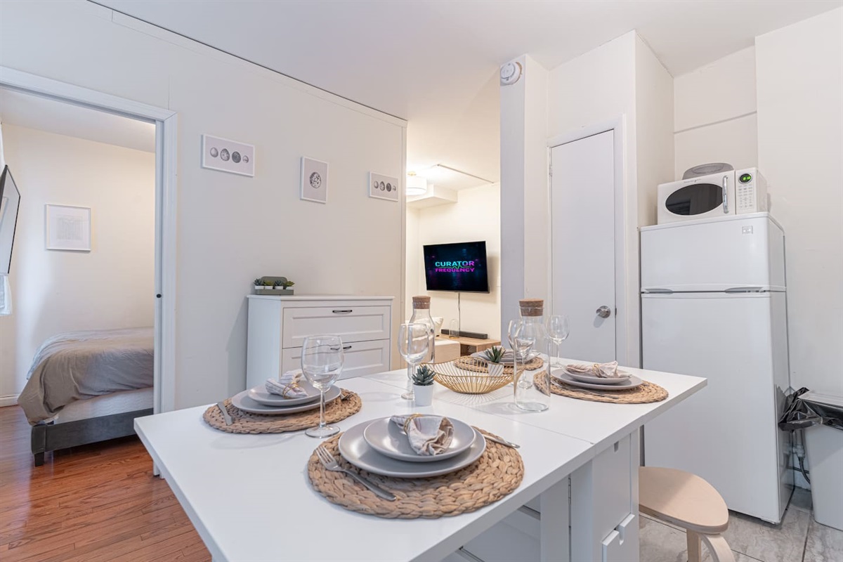 Fully equipped chef's kitchen with full-size appliances, cookware, and counter prep space — cook in or order from NoMad'