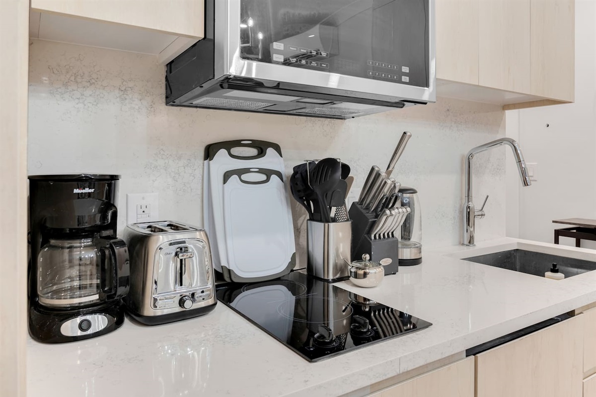 Fully equipped chef's kitchen with full-size stainless steel appliances and cookware — cook in or order from NoMad's bes