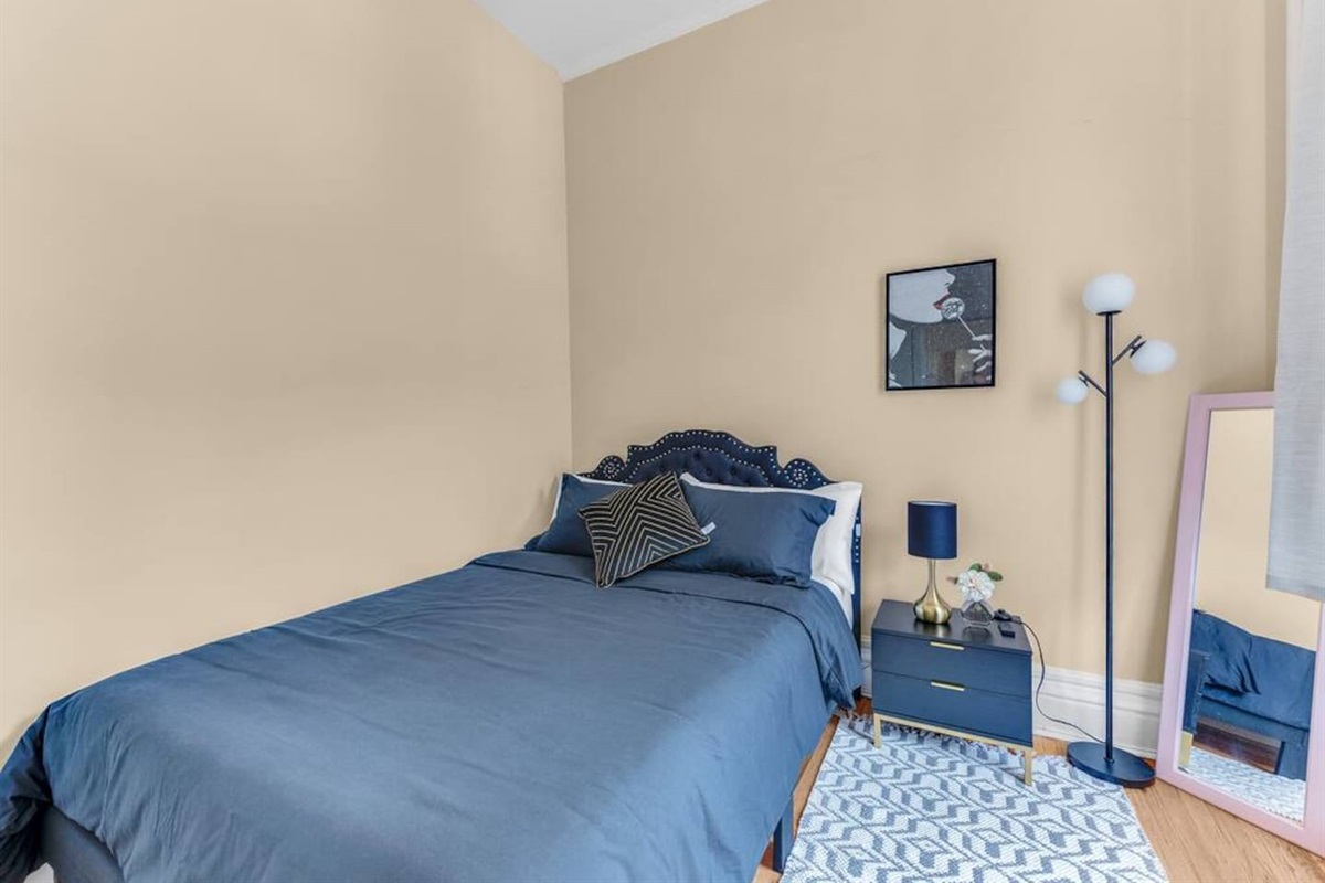 Primary bedroom with plush queen bed, fresh linens, and a restful atmosphere.