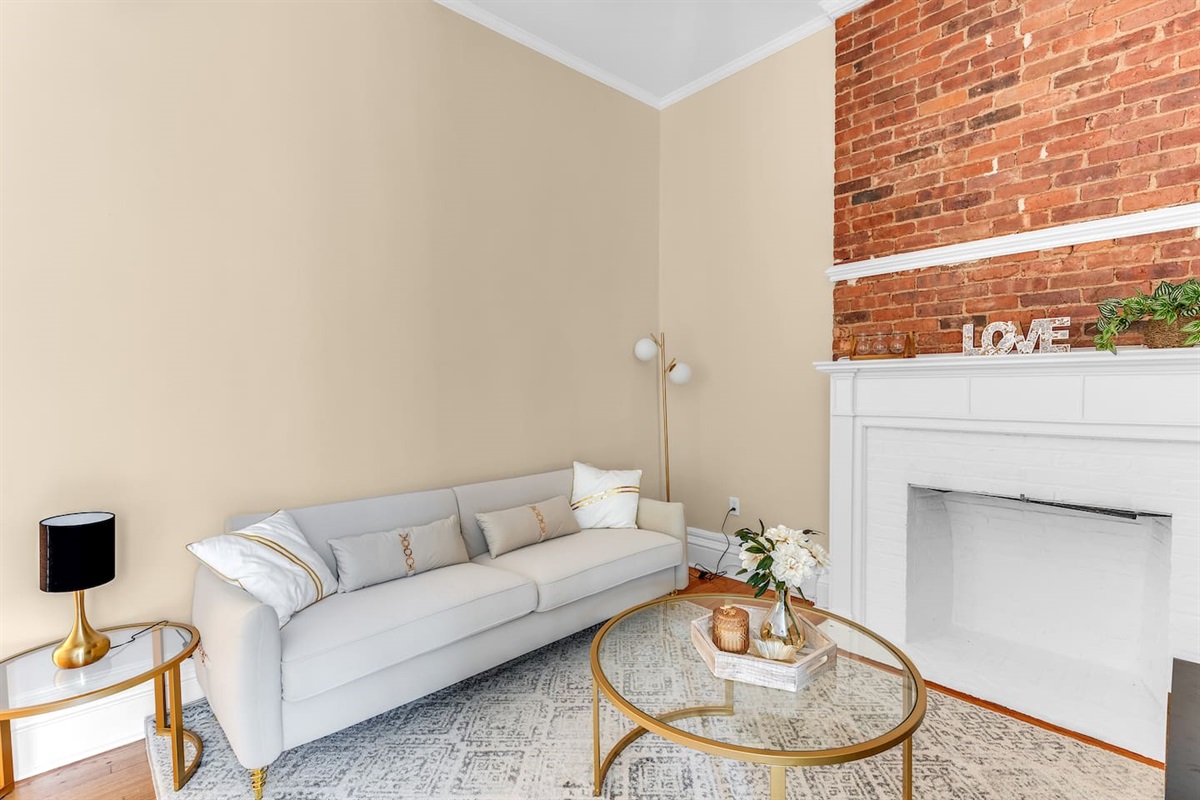 Comfortable open living area with smart TV and quality furnishings — relax after a day exploring NYC.