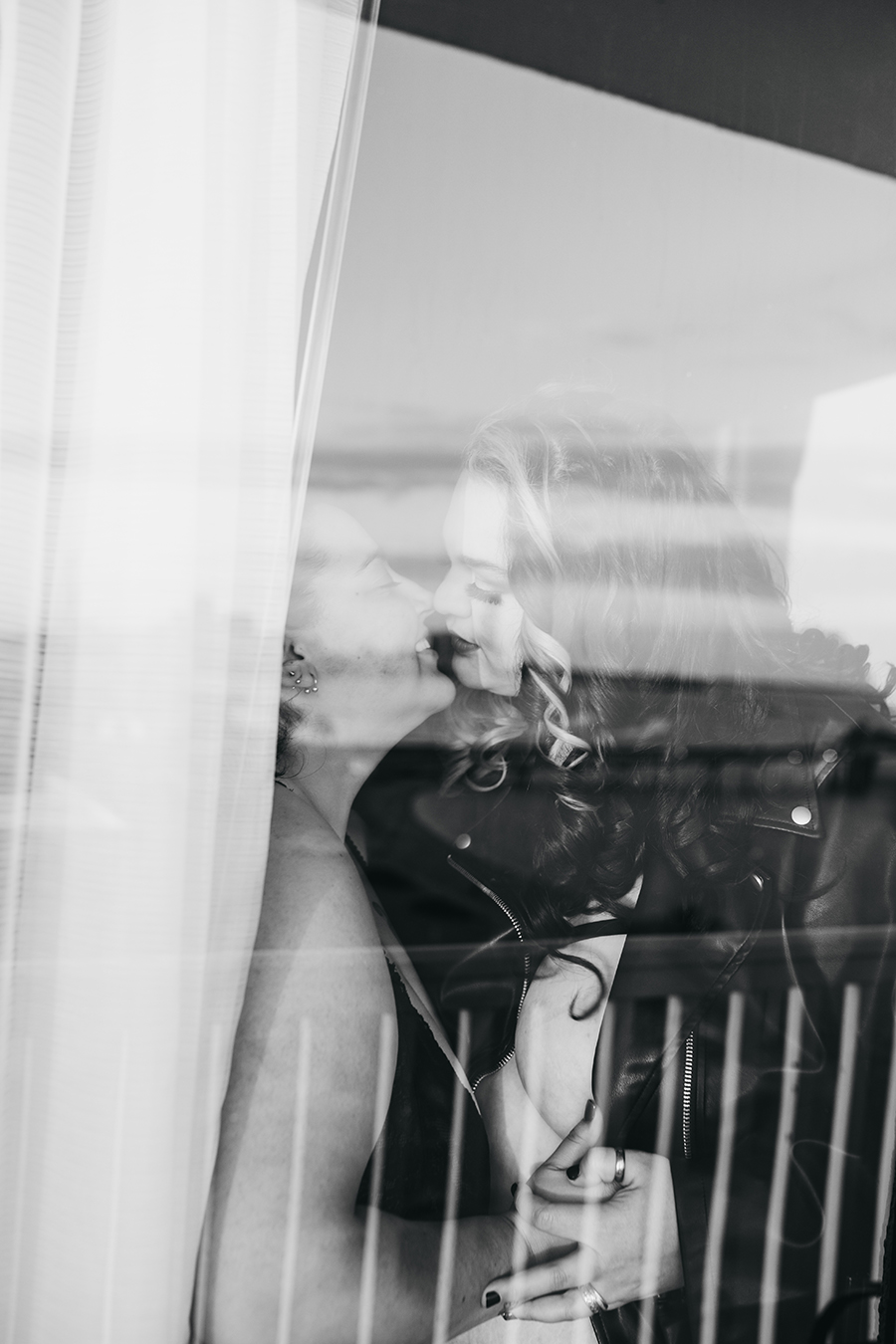 behind the glass caressing and connecting together