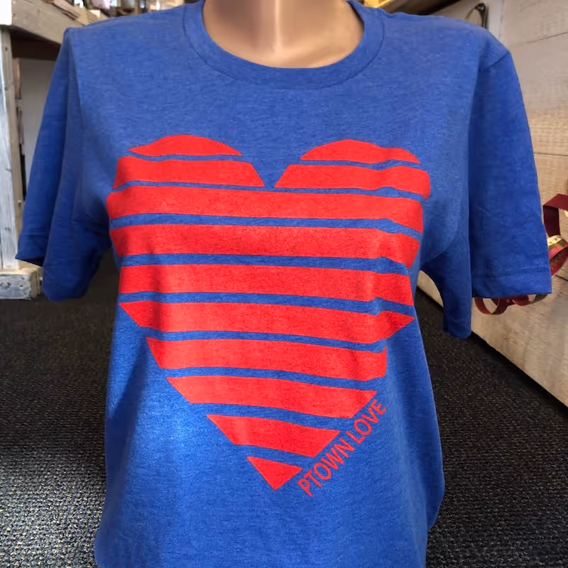 Ptown Love heart symbol displayed on a blue t-shirt