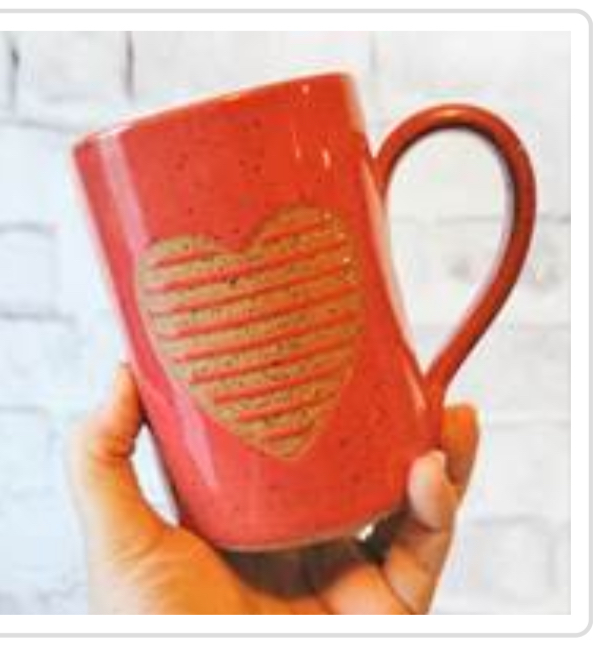 hand crafted red mug with a heart 
