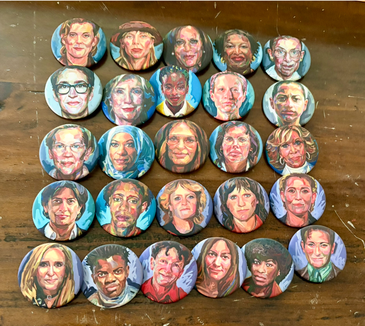 Selection of Persisters Pins by Jo Hay displayed on a table