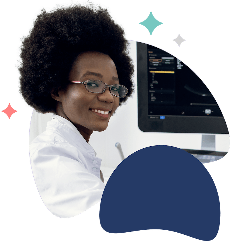 Smiling medical professional sitting near ultrasound equipment, representing expert care, advanced imaging, and personalized fertility assessments at Fyrtle.