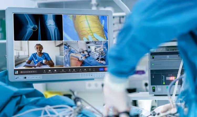 Surgical procedure in operating room with Proximie UI on a screen.
