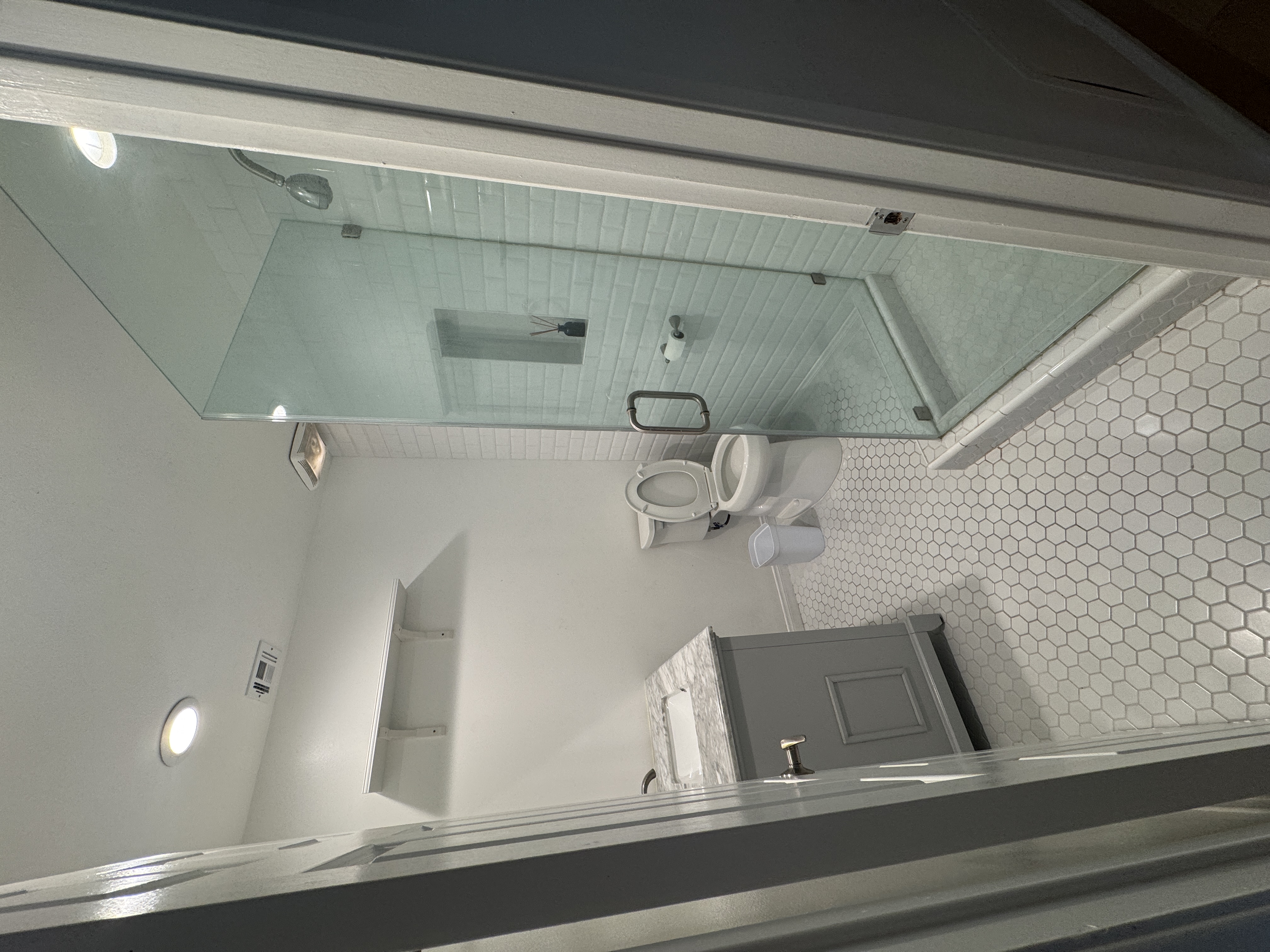 interior of a bathroom with a gold shower
