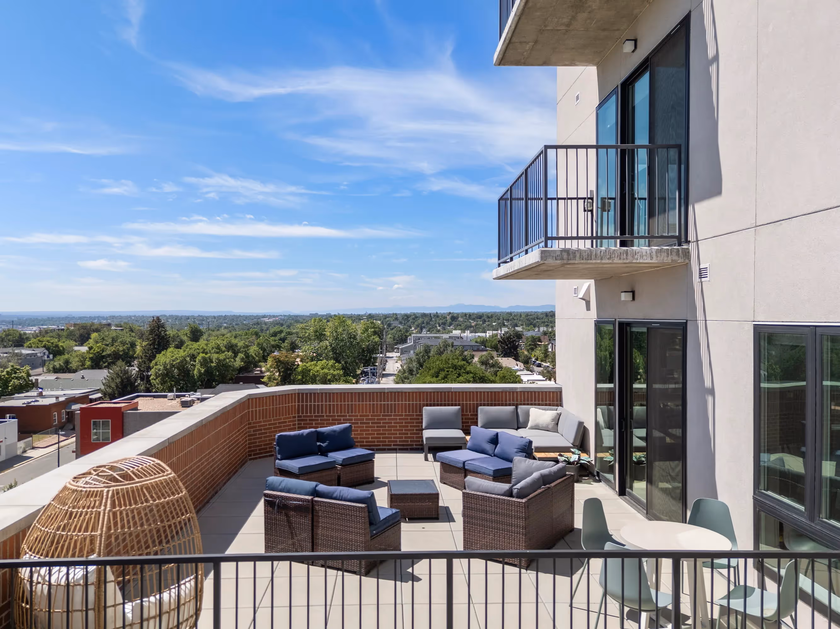 Close-up of a shuffleboard table with pucks in the common area at The Julian apartments in Sloans Lake, Denver, offering resident entertainment.