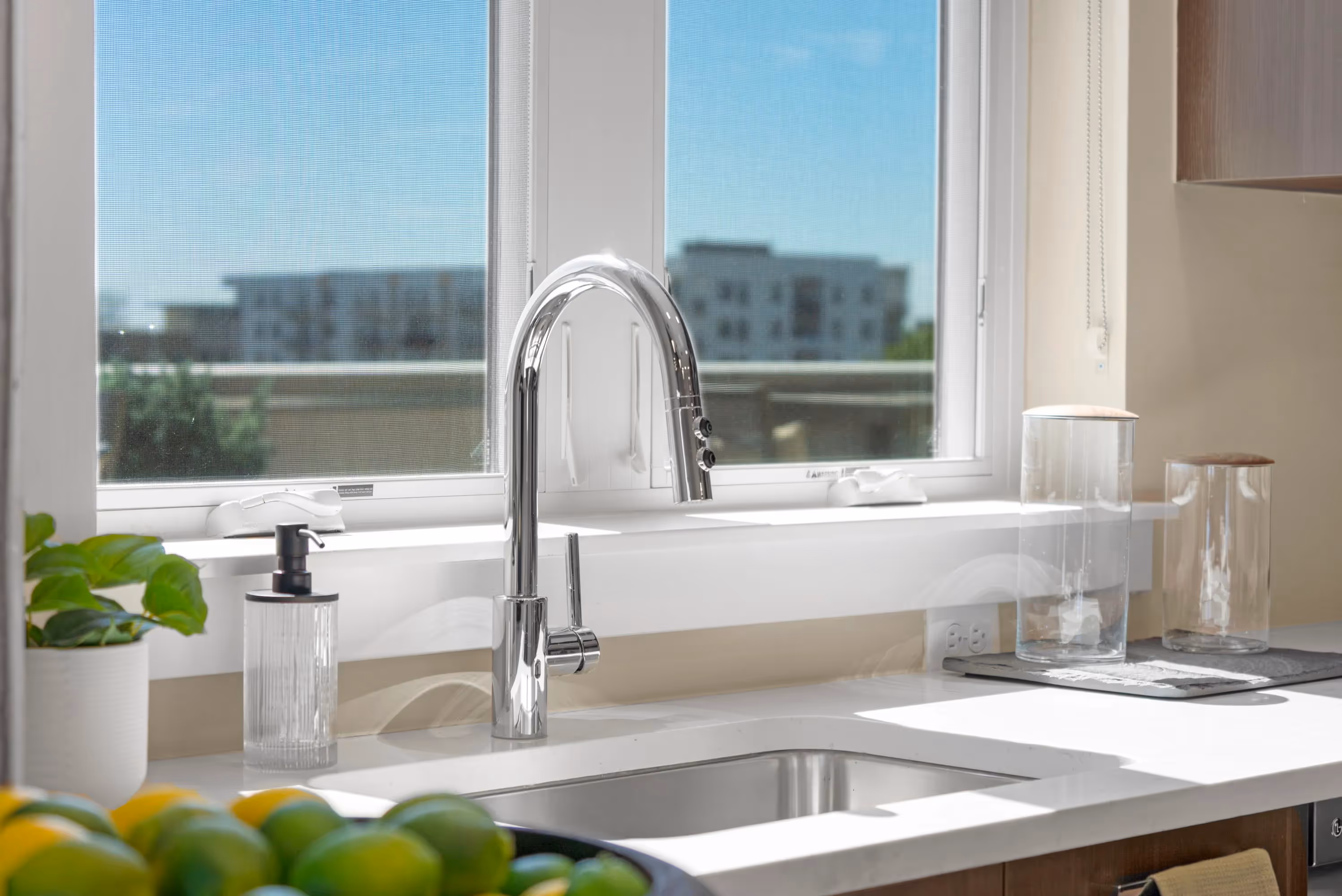 Bedroom with direct access to a private balcony and views of the city in a luxury apartment at The Julian, Sloans Lake, Denver.