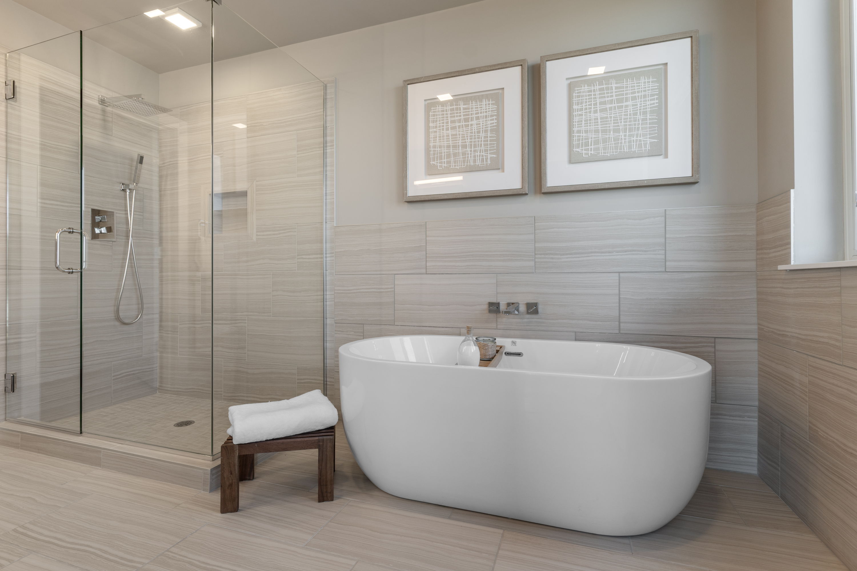 Close-up of a stylish living room area in a Julian apartment, showing a textured sofa, wooden coffee table, and large windows, highlighting modern design.