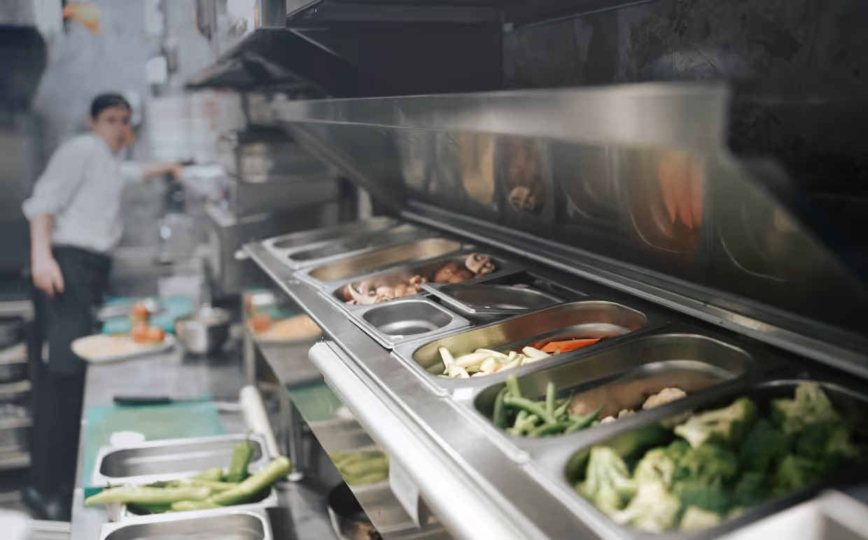 a chef cooking in mobile kitchen trailer