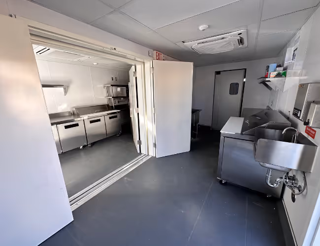 A interior view of aouble unit container kitchen