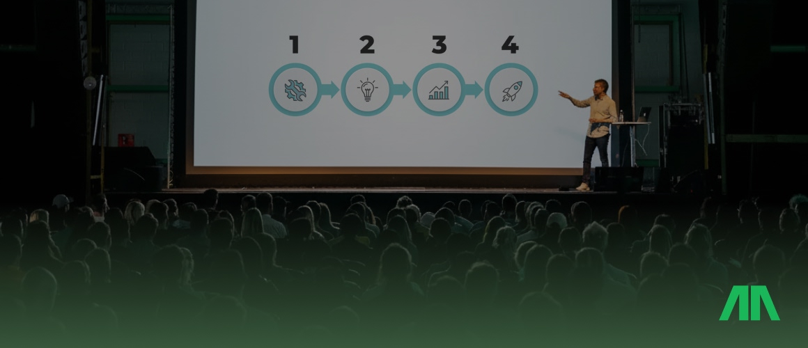 Trener personalny pokazuje na tablecie dane dotyczące postępów treningowych.