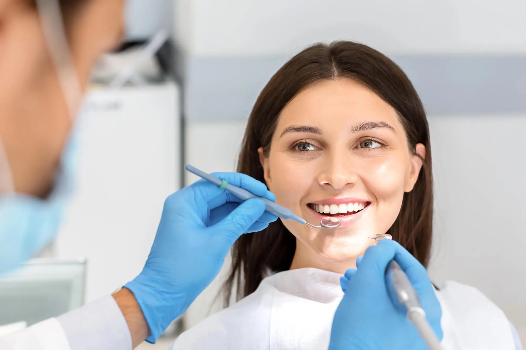 Smiling Woman Receiving Cosmetic Dentistry Grand Prairie Treatment