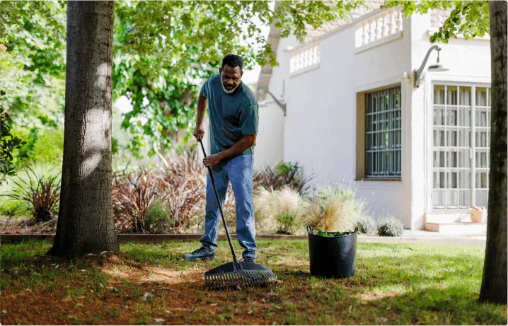 A man working on his yard