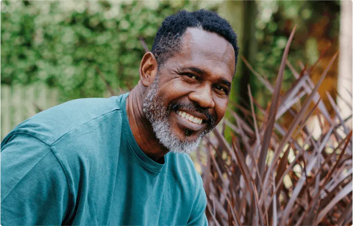 A man smiles at the camera