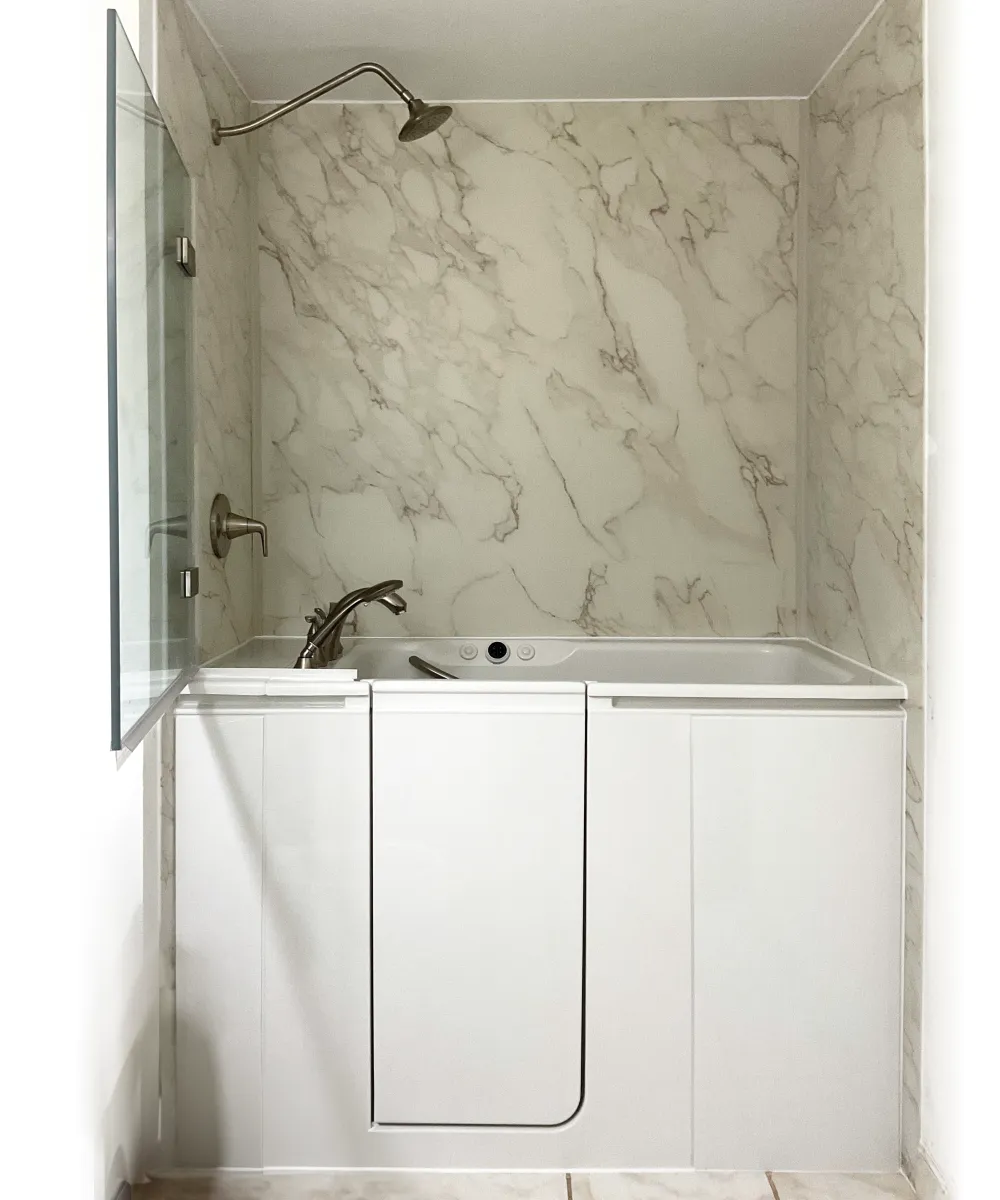 Modern Kohler shower remodel featuring sleek, glass panels and contemporary finishes.