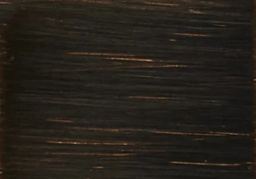 A close-up of a bronze swatch, showcasing its smooth and reflective surface.